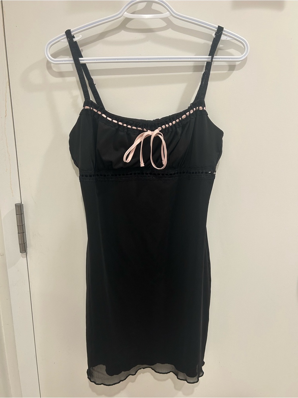 Black mini dress with pink bow detail